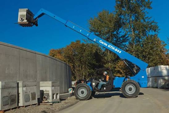 Genie telehandler placing material on a commercial construction site